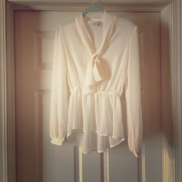 Cream long sleeve top with peplum bottom
