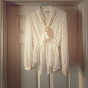 Cream long sleeve top with peplum bottom