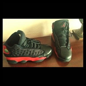 5 black and red Jordans