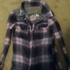 Plaid pink, white, and grey shirt.