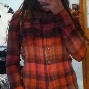 Plaid, maroon shirt.