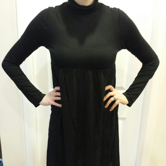 Velvet Torch black turtle neck.