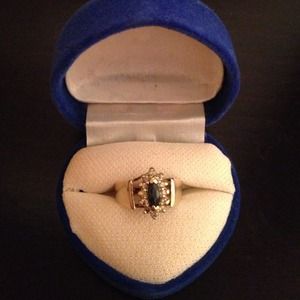 Beautiful sapphire center surrounded by diamonds!