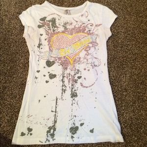 White shirt with rhinestone accents.