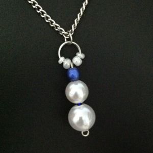 Pendant of white and blue pearl bead necklace
