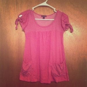 Pink and white polka dot baby doll shirt.