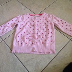Pink sweater with red polka dots