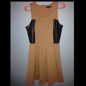 Light brown dress with black leather patches.