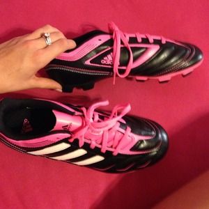 Hot pink black and white Adidas cleats