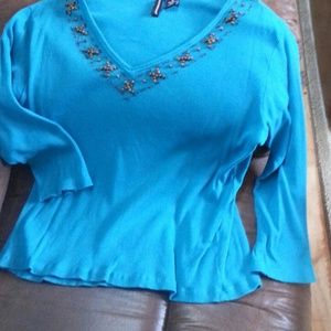 Deep turquoise, V neck,  trimmed in wooden beads.