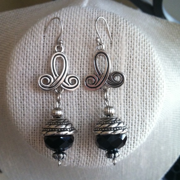 Black and silver earring .