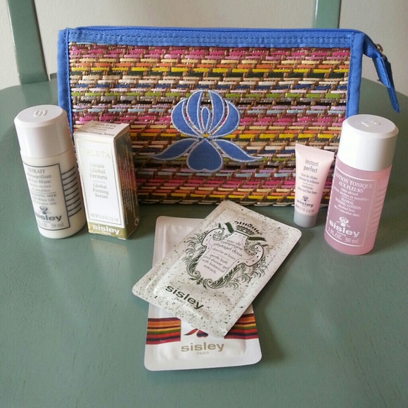 NWOT Sisley cosmetic bag and travel sized skincare