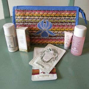 NWOT Sisley cosmetic bag and travel sized skincare