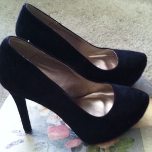 Black, suede platform pumps. Black, suede platform pumps.