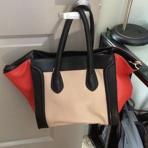 Just fab phantom shaped handbag