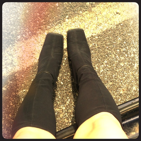 Tall black heeled boots.