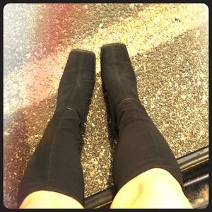 Tall black heeled boots.