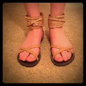 Brown leather sandals with tribal stitching