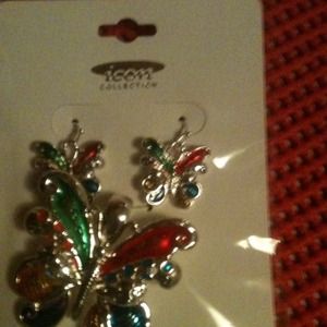 Silver toned butterfly pendant and earring set