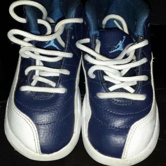 White and navy blue jordan.12s   size 9c