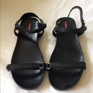 Prada patent leather flat sandal.