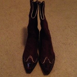 Brown suede like cowboy boots trimmed in gold.