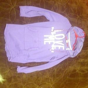 A Purple hoodie with white writing