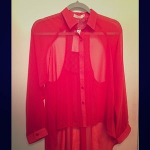 Coral sheer open back blouse.