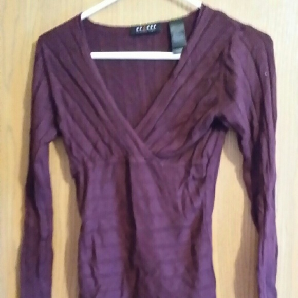 Purple sweater.