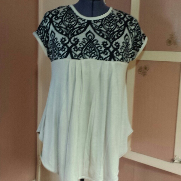 Beige & black patterned top.
