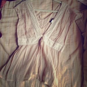 Lace detailed beige top.