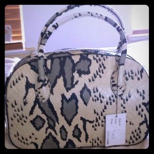 Faux print bag.... Great add to any outfit!