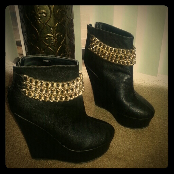 Never worn goregous black booties with gold chain