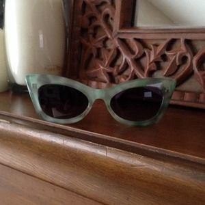 Green, vintage inspired cats eye sunglasses.