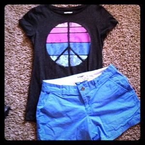 Peace top with blue shorts