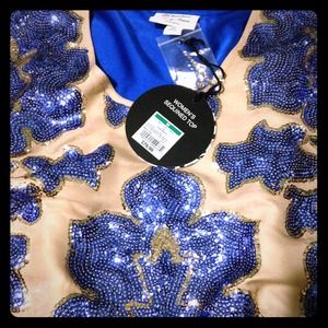 From $50 now $42. Stunning women's sequined top