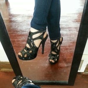 Black intricate cage buckle heels