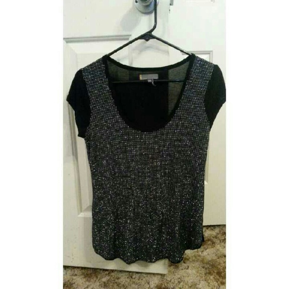 Cute top with shiny detail on the front!