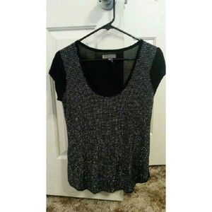 Cute top with shiny detail on the front!