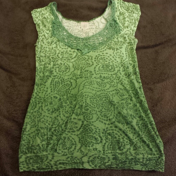 Green blouse with lace collar.