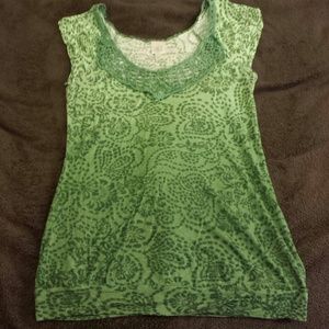 Green blouse with lace collar.