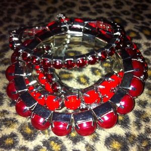 5 red bracelets still in the binding.