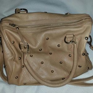 Tan leather studded hand bag. A bit used.