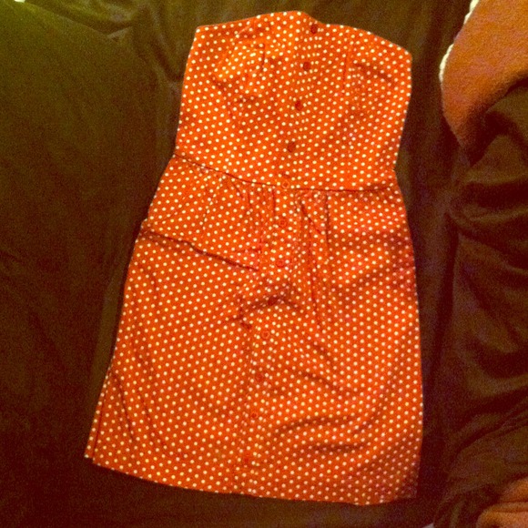 Strapless red dress with white polka dots.