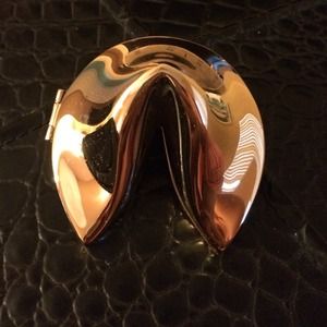 Gold colored fortune cookie.