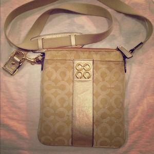 Authentic Coach gold swingback cross body purse