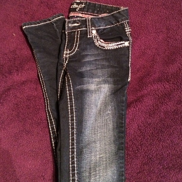 Size 0, skinny jeans dark wash, with cute designs. - Picture 1 of 3