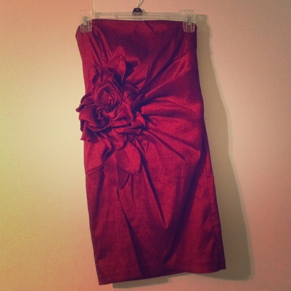 Strapless deep-red evening gown.