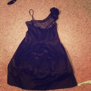 Embellished black special occasion dress.
