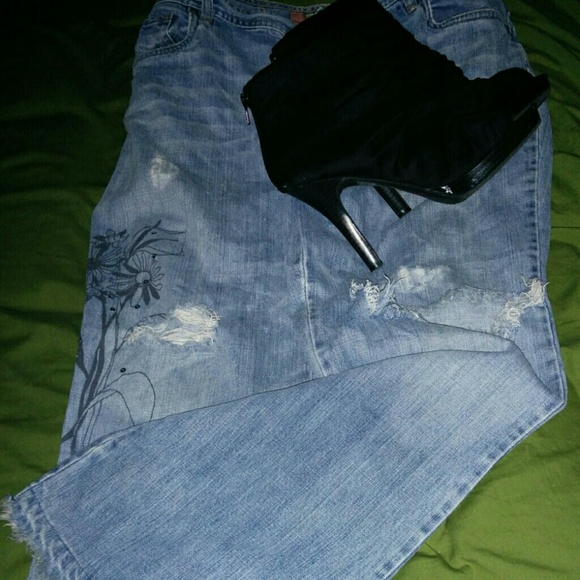 Jeans worn with holes in knee